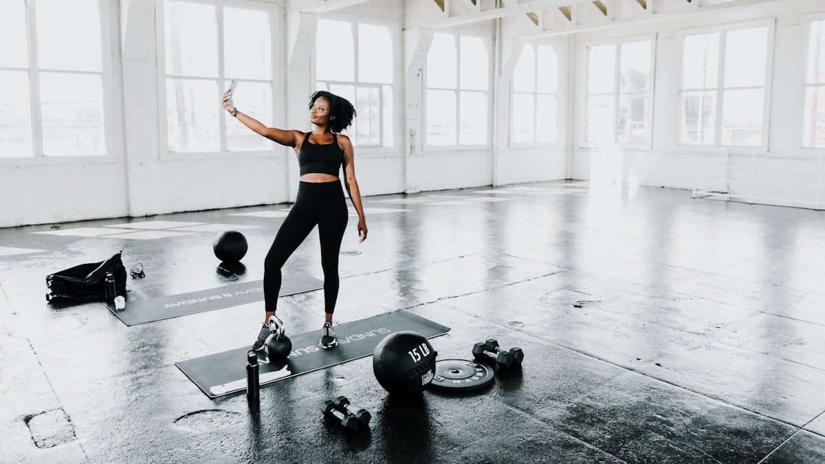 a woman is doing exercises in a gym